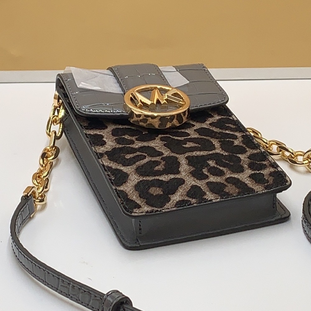 Brand New with Tag
Michael Kors Carmen Small NS Phone XBODY HairCalf Gre… - Picture 8 of 16